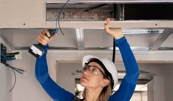woman installing a air vent