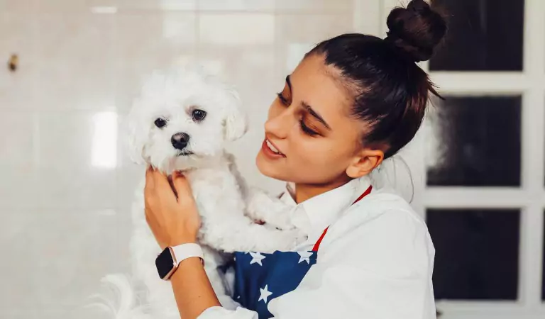 woman with her dog inside of her house