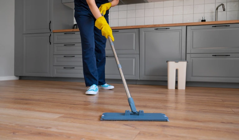 Front view woman cleaning home