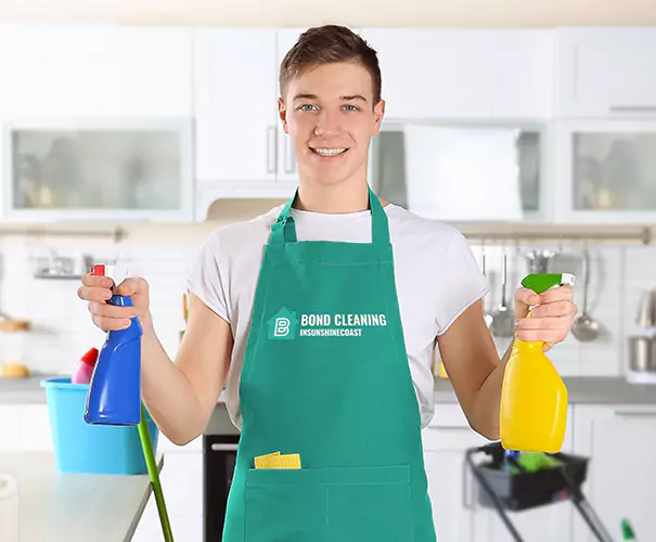 Bond cleaning Sunshine Coast Expert with spray bottles in hands