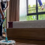 Women cleaning a bedroom