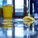 A person cleaning the floor