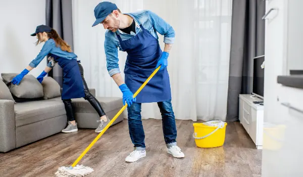 Close up of housekeepers cleaning the apartment