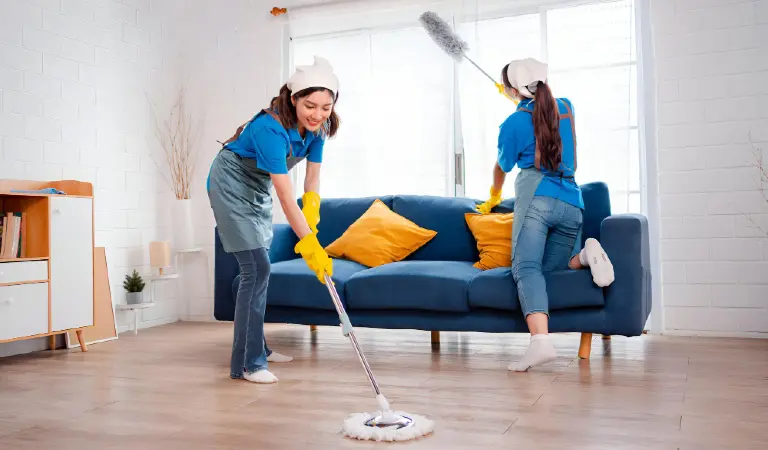 Happy housework or house keeping service female singing and cleaning dust in house cleaning